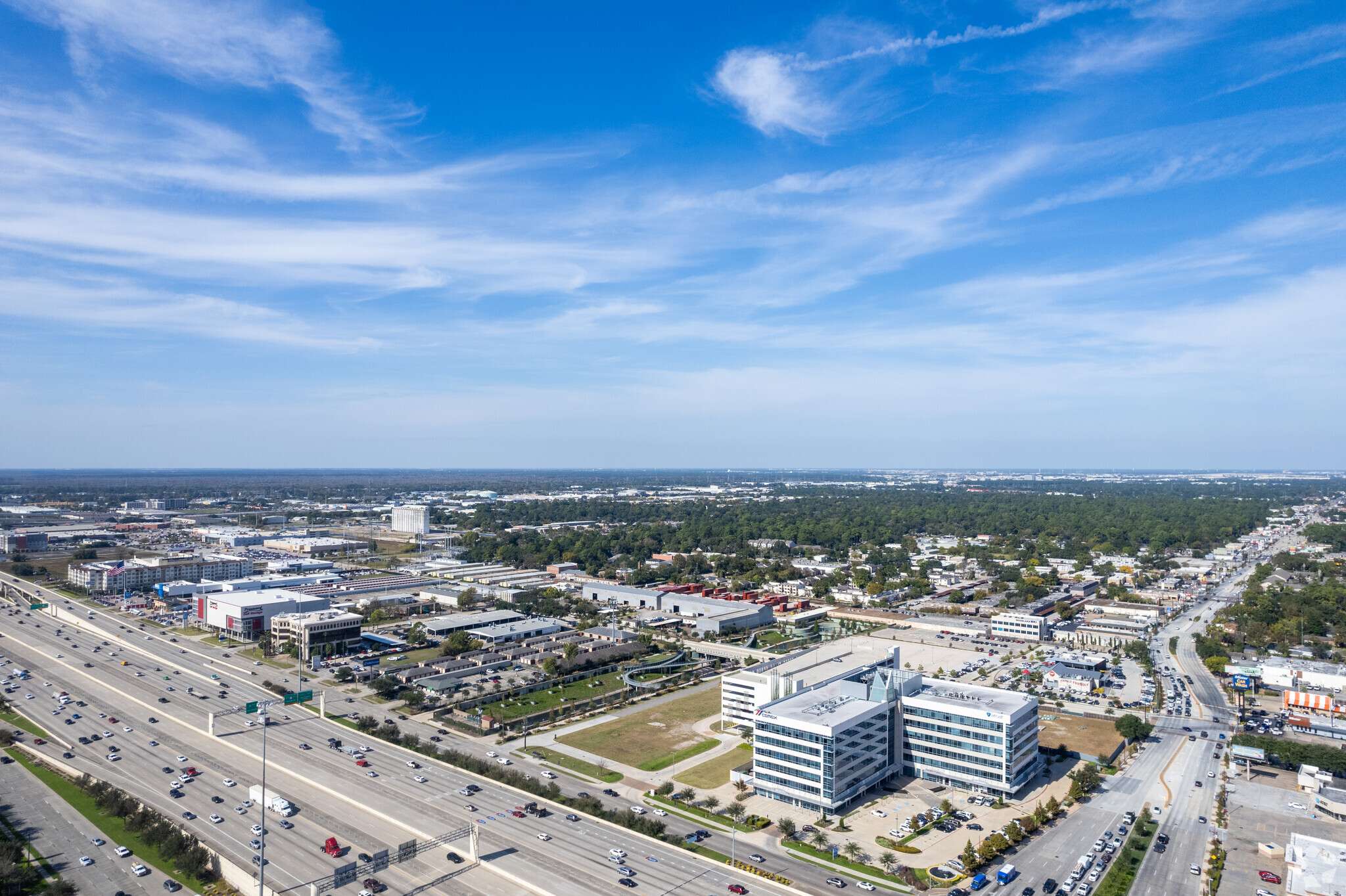Aerial view over the Katy Freeway corridor with 10100 Katy Freeway among the surrounding buildings