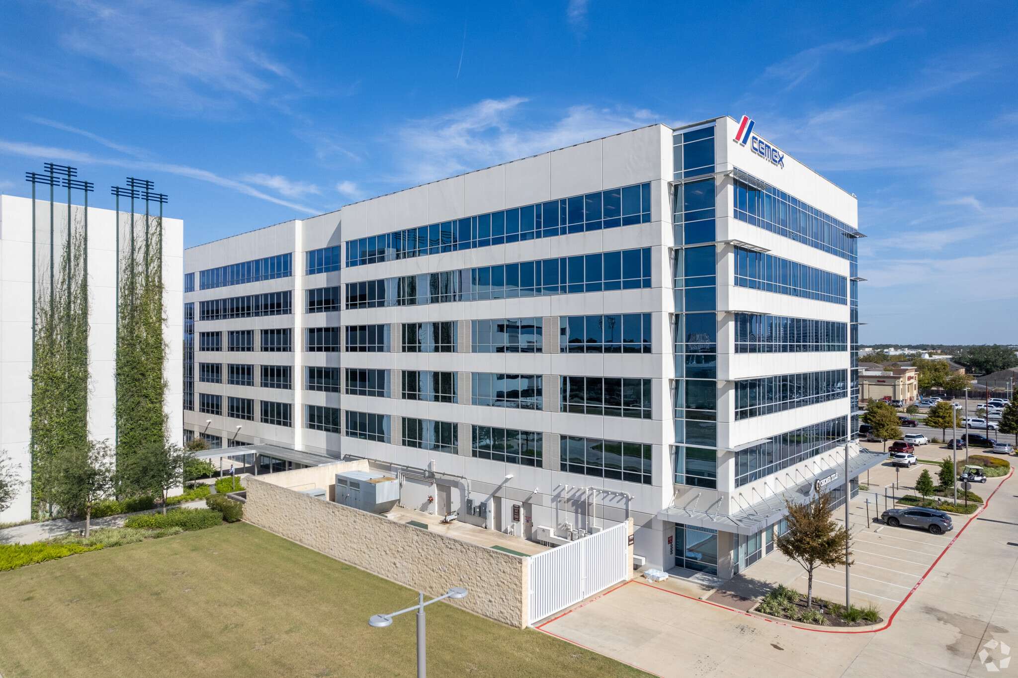 Aerial view of the office building at 10100 Katy Freeway and its surface parking