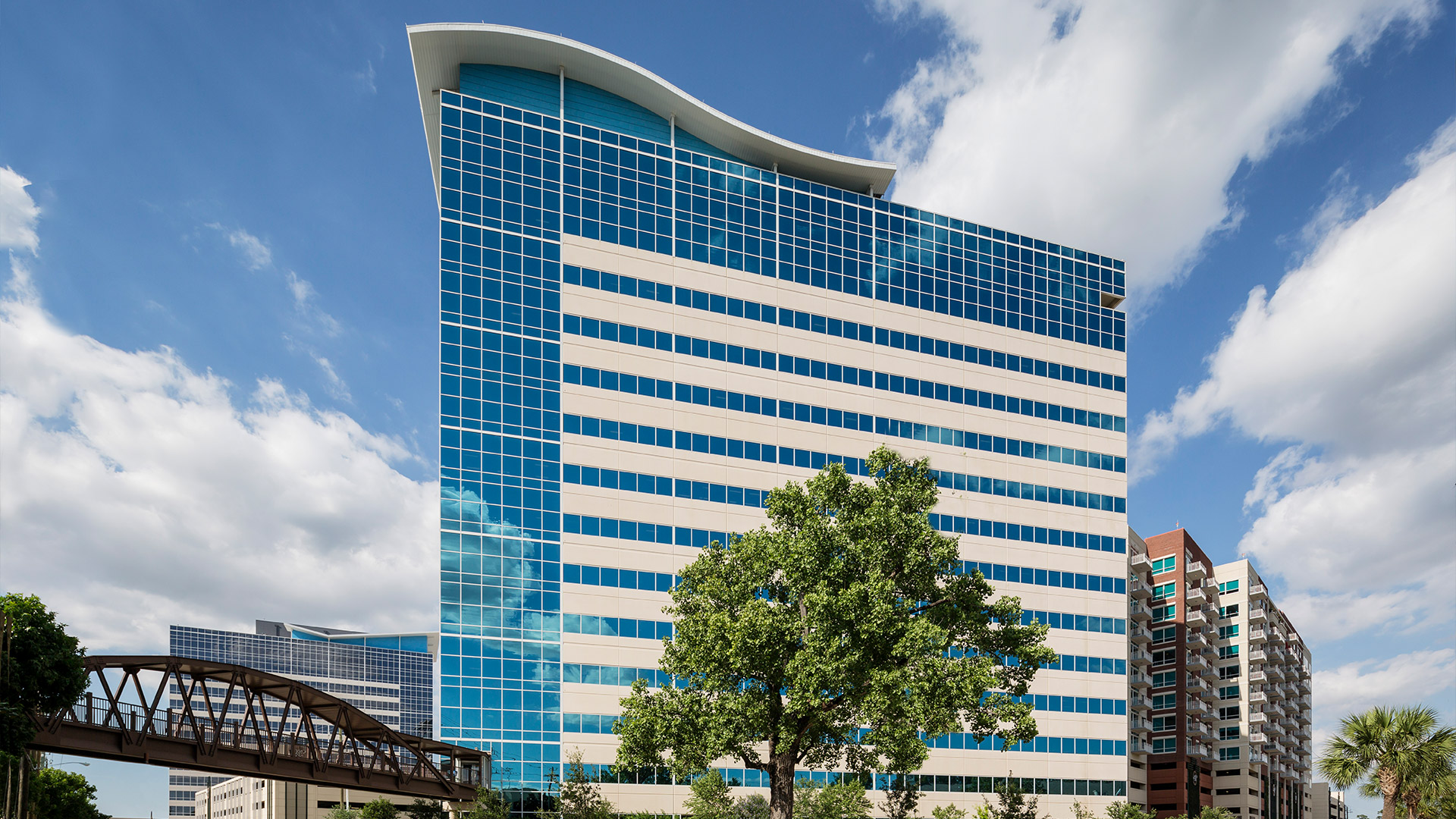 Exterior of Cobalt Center at 920 Memorial City Way, with its curved glass crown