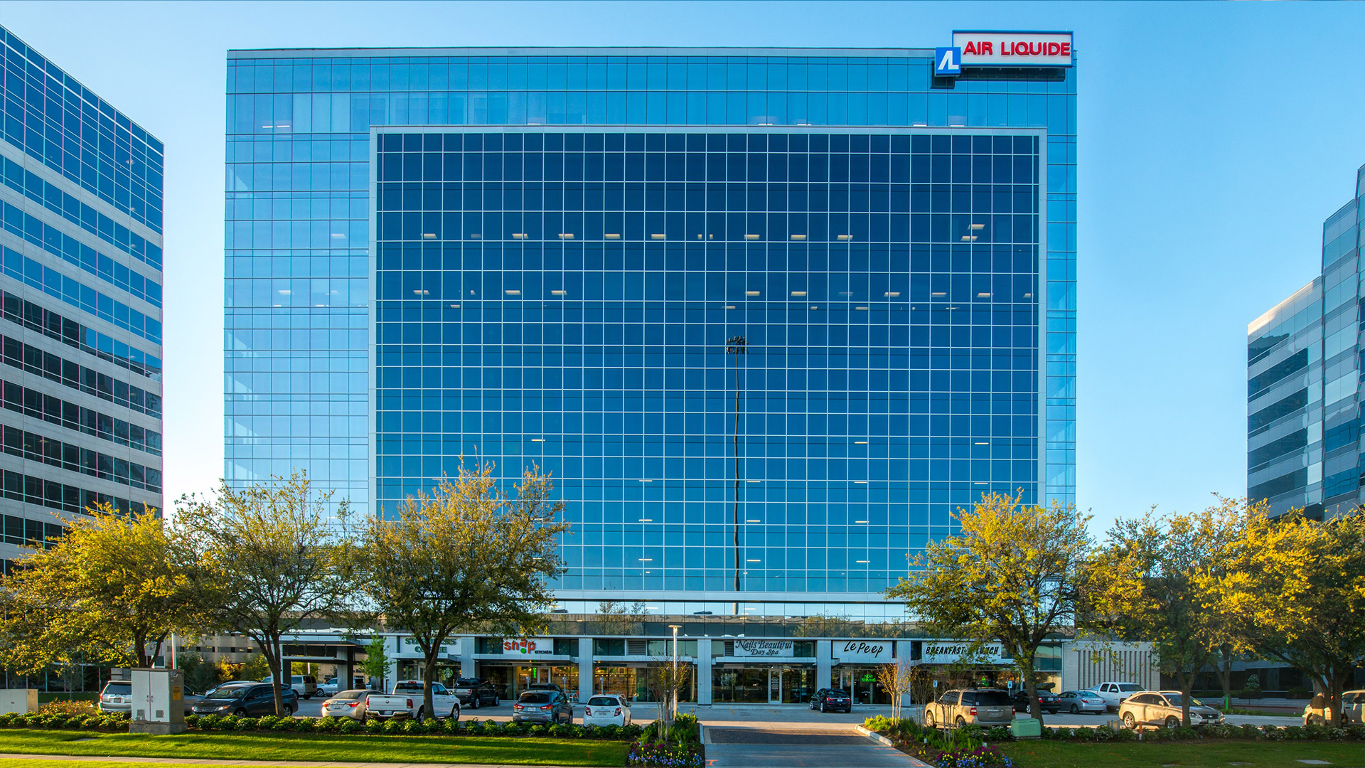 Air Liquide Center, a blue glass tower with the Air Liquide sign at its roofline