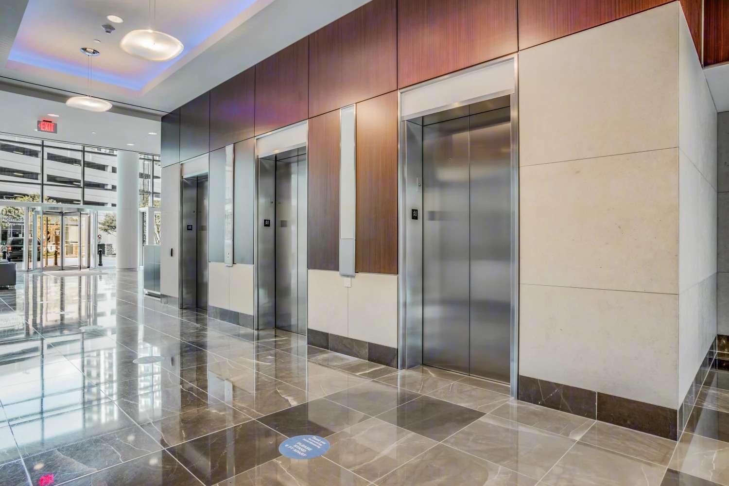 Elevator lobby at 920 Memorial City Way with stone walls and wood panelling