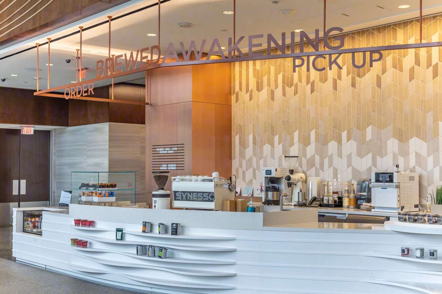Coffee counter at the Murphy Building with pick-up signage and espresso equipment