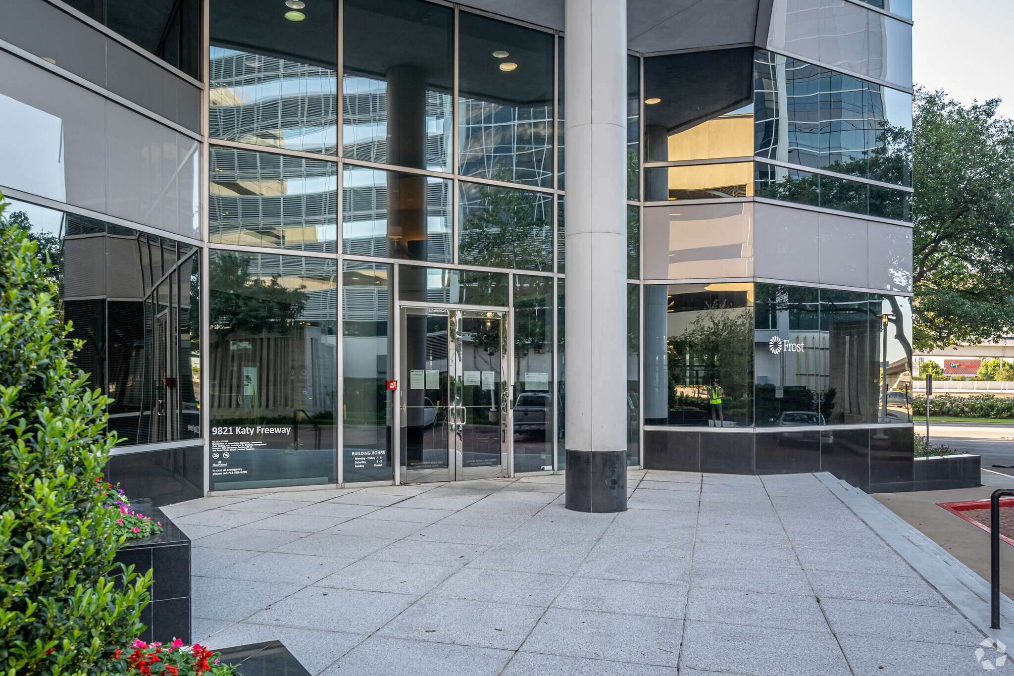 Street-level entrance and paved plaza at 9821 Katy Freeway