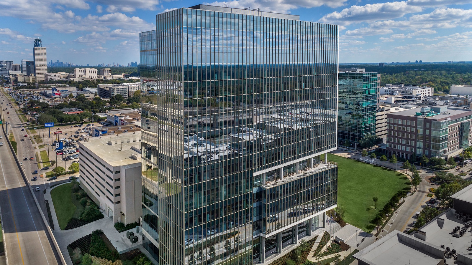 Aerial view of the 990 Town & Country office tower and the surrounding development