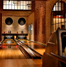 Bowling lanes in a brick-walled entertainment venue at CityCentre