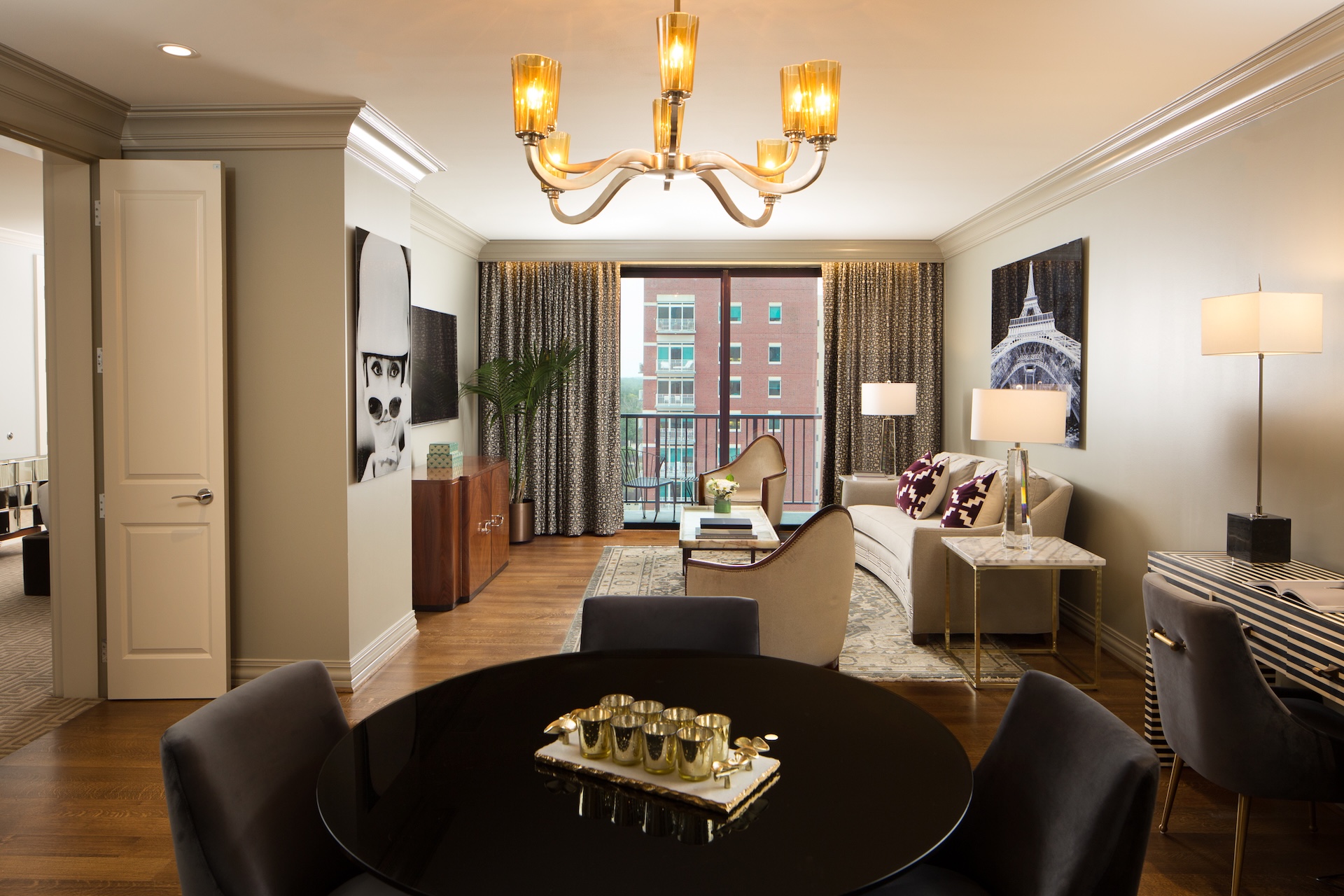 French suite living room at Hotel ZaZa Memorial with a chandelier above a round table