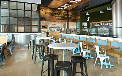 Mendocino Farms (1) Fast-casual restaurant interior at M-K-T Heights with a service counter and teal metal chairs